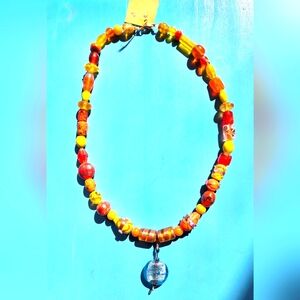 Hand crafted glass beaded necklace with glass pendant.